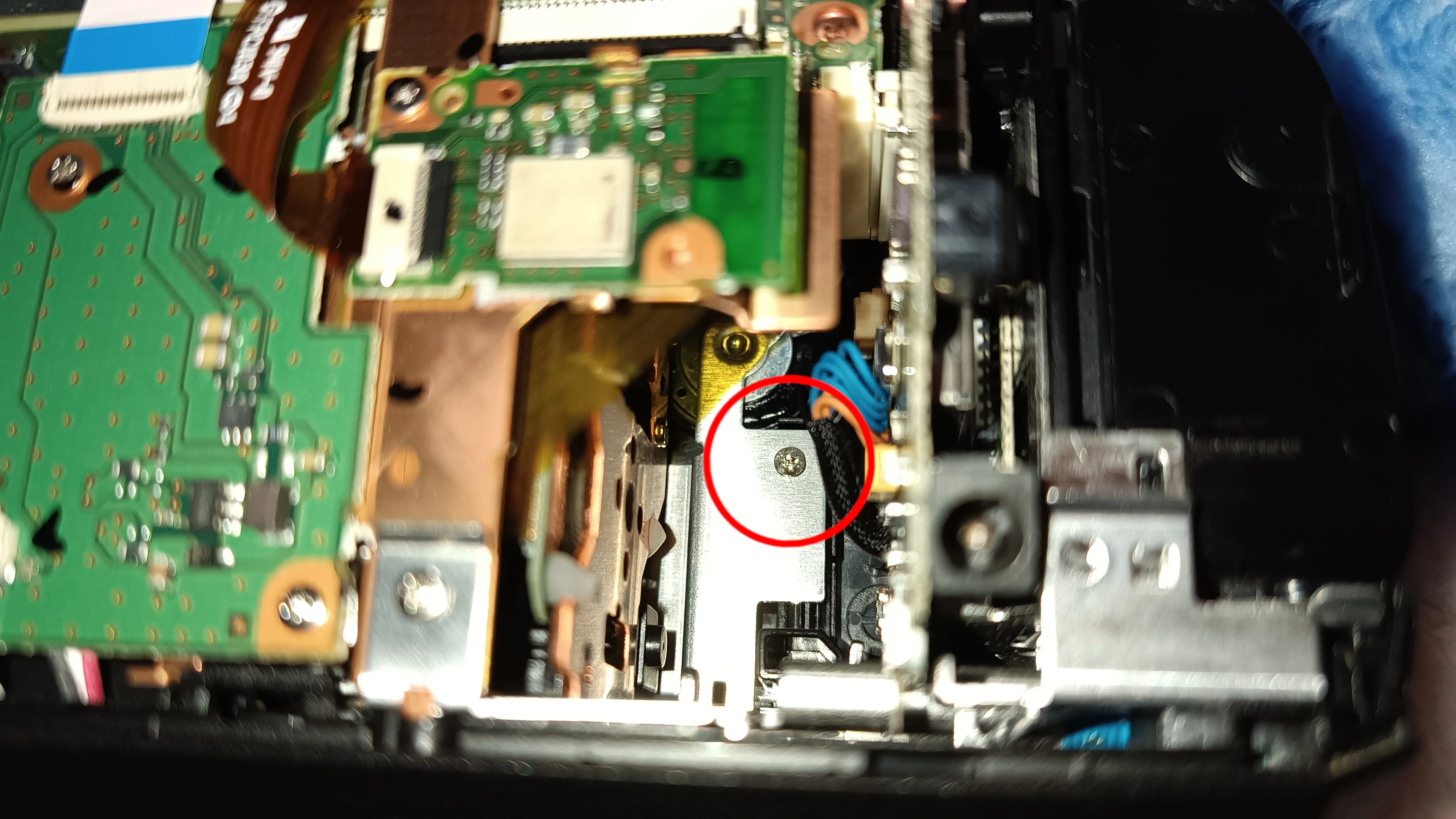To open the cover at the display, one little screw inside the camcorder is necessary to remove.