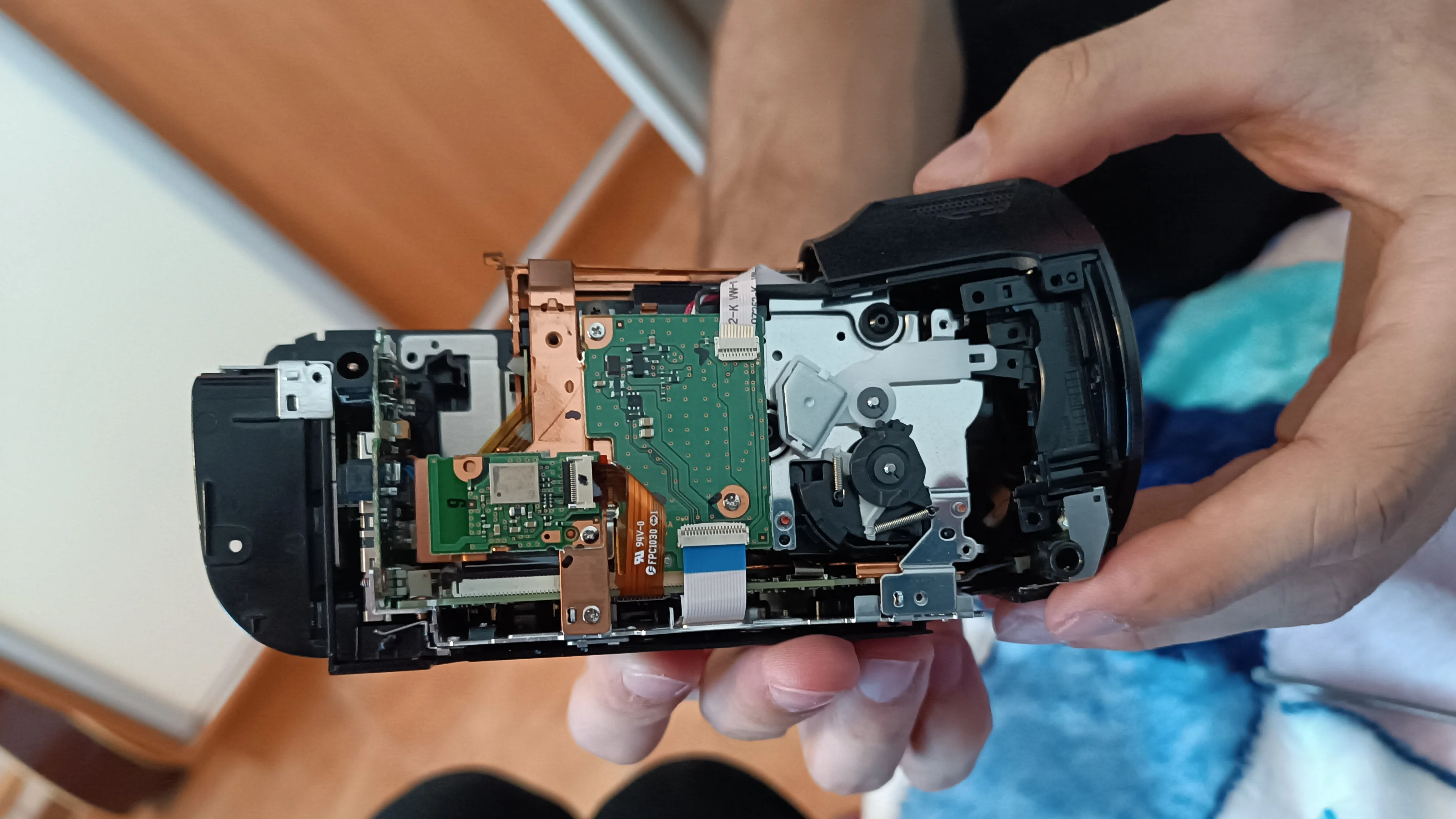 Even the cover around the lens needs to be detached. No need to completely remove it, I kept the cables connected.