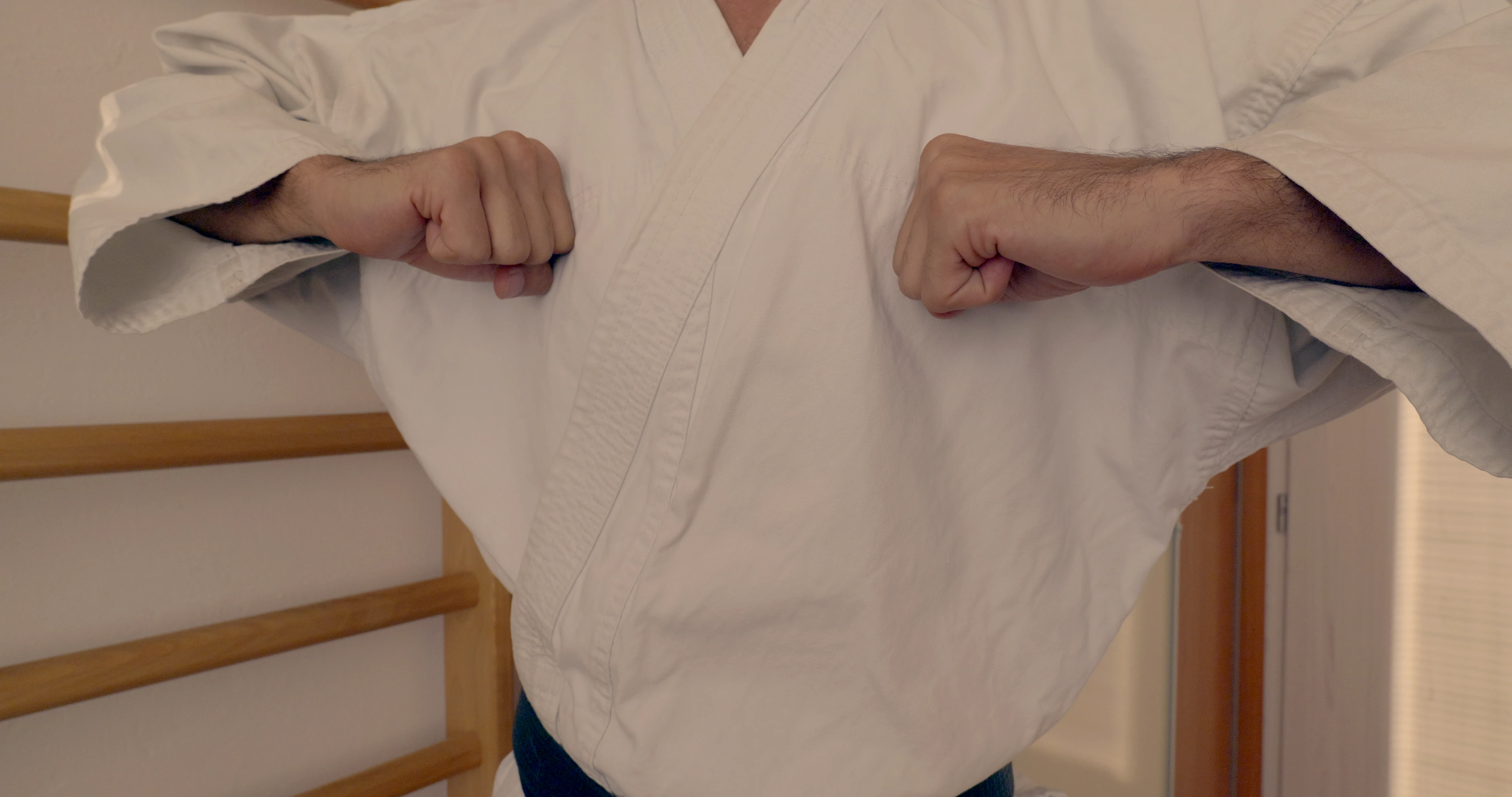Beginning pose of a Shotokan karate kata Tekki Nidan. Resembles relaxing and leaning against an obstacle with the elbow.