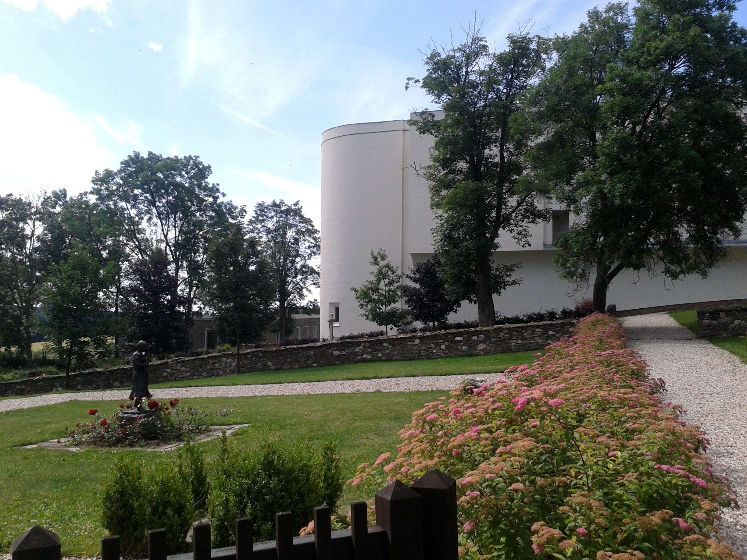 Garden in front of the guesthouse with monastery in the background